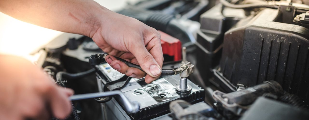 Field Technician Performing Car Jump Start Service in Houston
