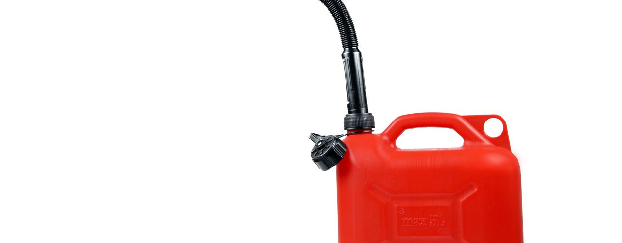 Plastic canister for fuel with a hose on an isolated white background
