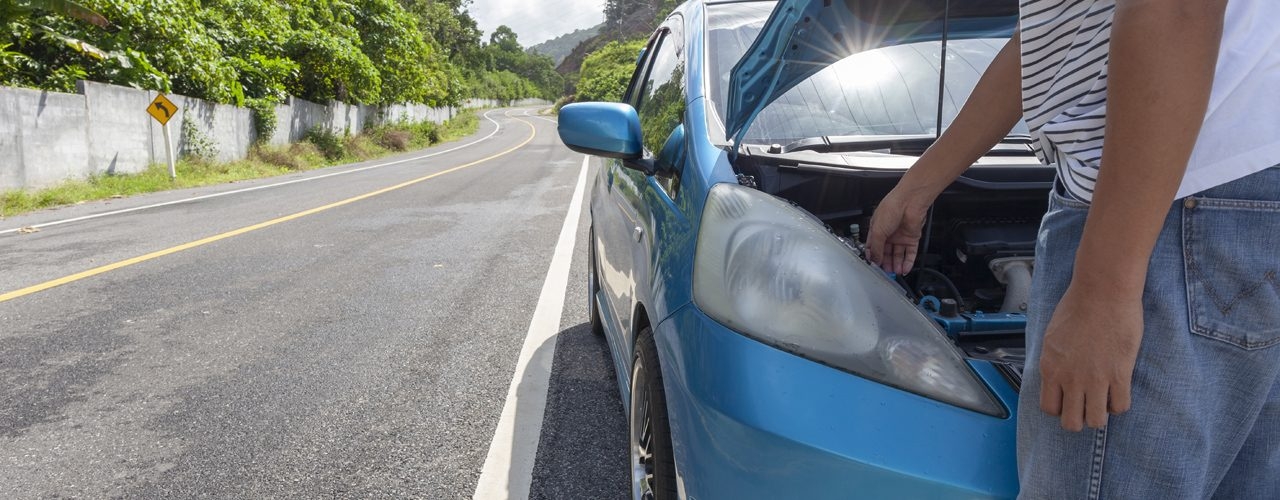Man With Hood Open Waiting For Roadside Assistance