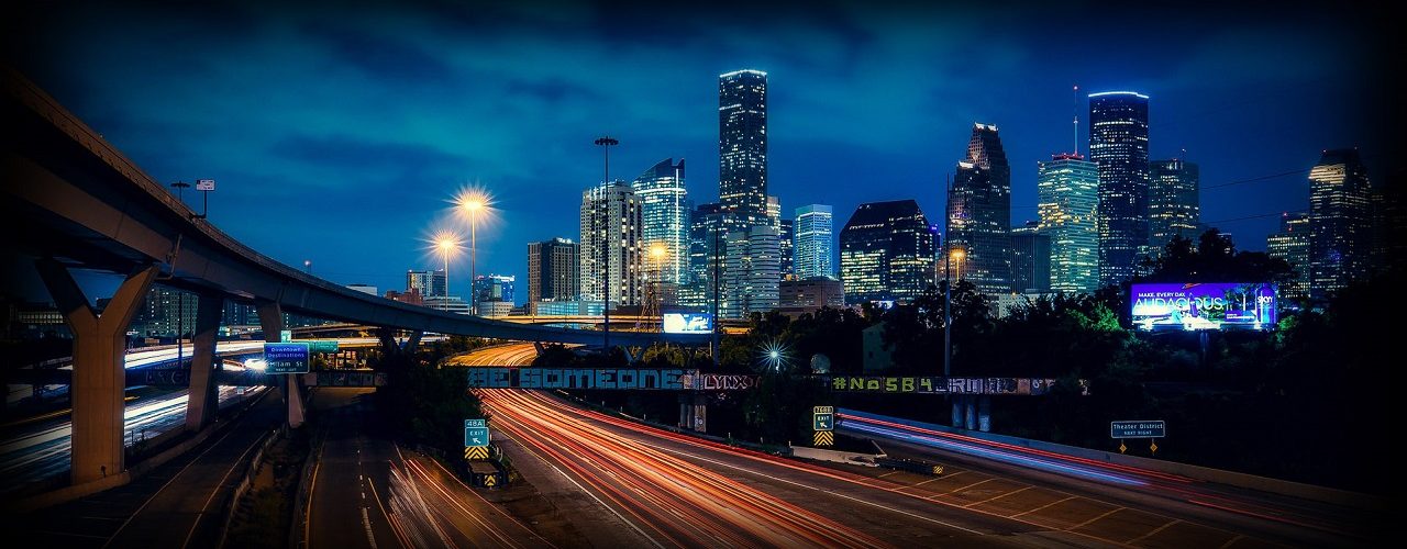 Traffic Lights And Houston Texas Skyline At Night