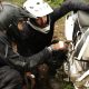 two men checking a motorcycle