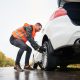 man changing his flat tire